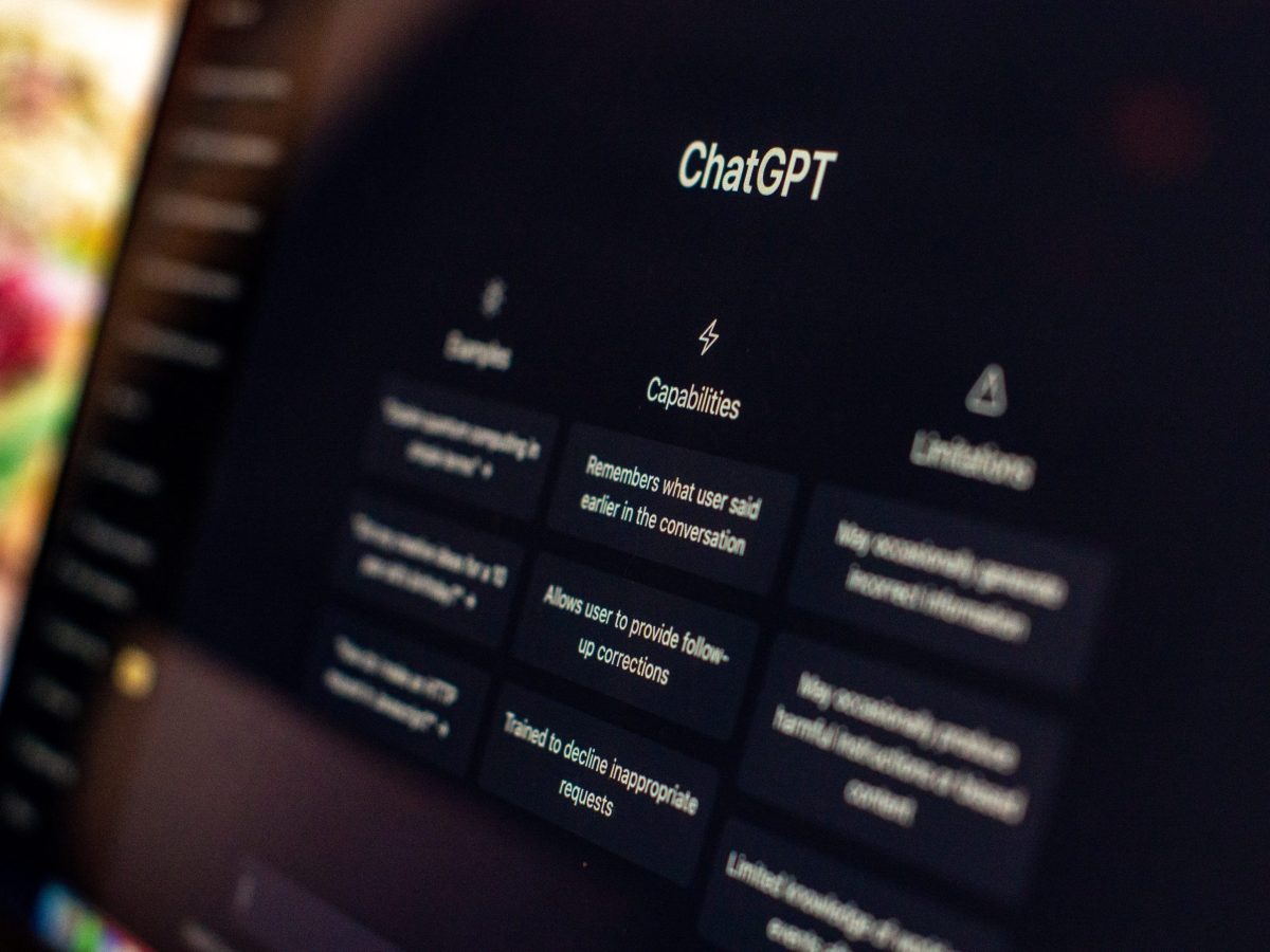 A laptop screen displaying the homepage of ChatGPT.